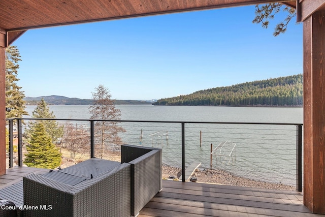 balcony with a water and mountain view