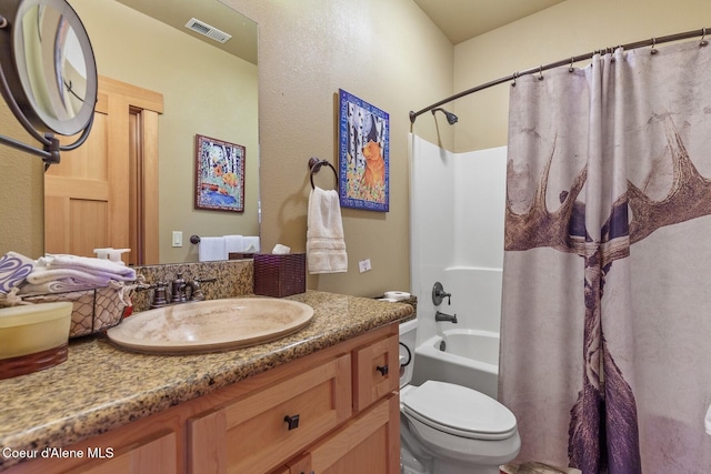 bathroom with visible vents, toilet, shower / bath combo, and vanity