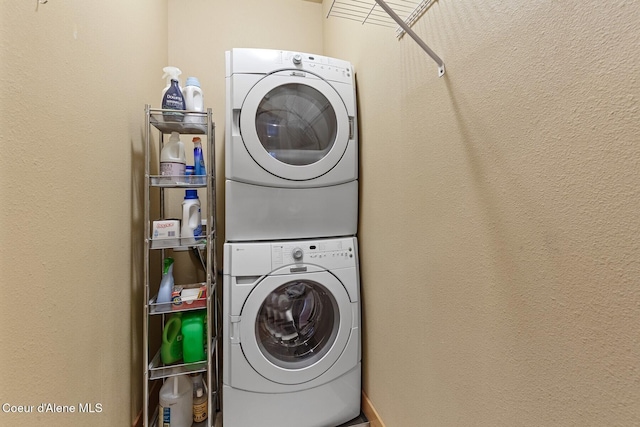 laundry area with laundry area and stacked washer and clothes dryer