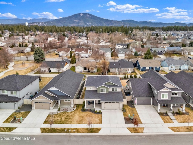 birds eye view of property with a residential view and a mountain view