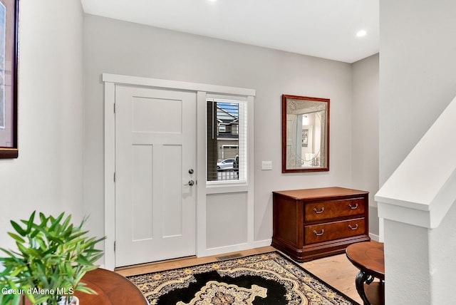 entrance foyer featuring baseboards and light wood-style flooring