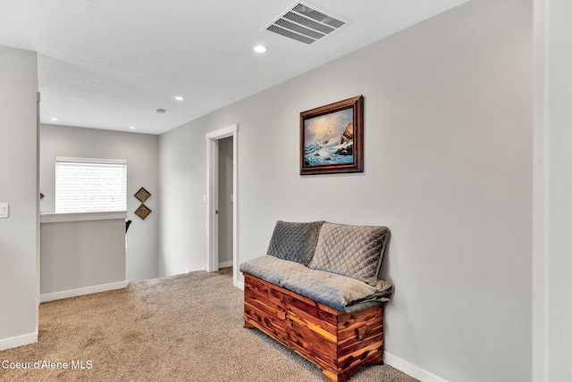 sitting room with recessed lighting, carpet, visible vents, and baseboards