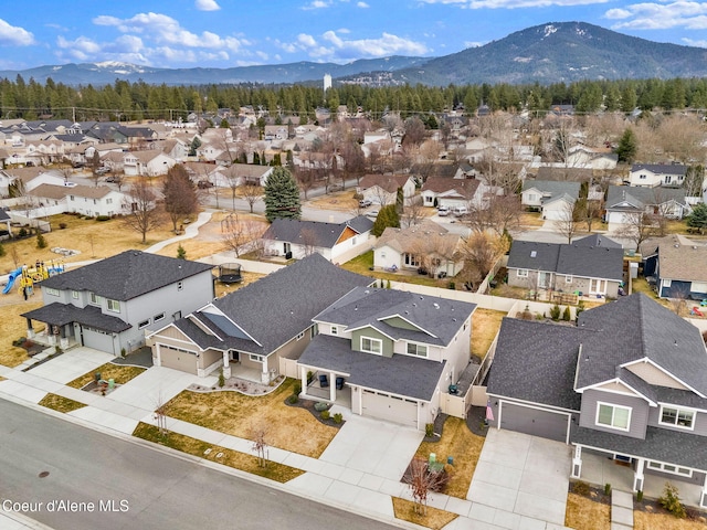 drone / aerial view featuring a mountain view and a residential view