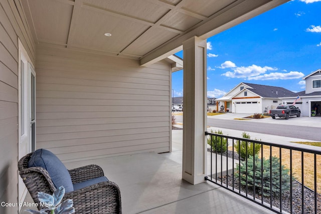 balcony featuring a residential view and a porch