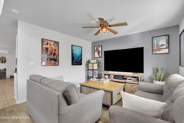 living area featuring light wood finished floors and a ceiling fan