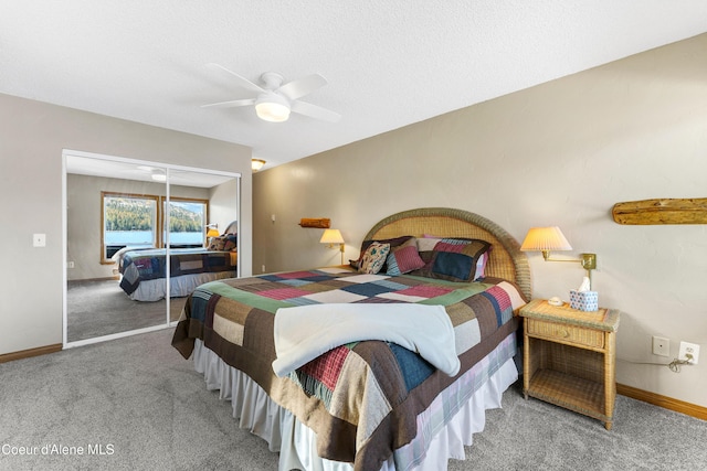 bedroom featuring a closet, baseboards, a ceiling fan, and carpet floors