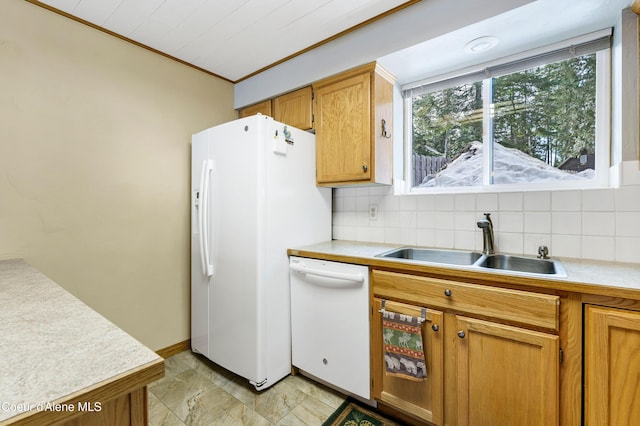 kitchen with white appliances, a sink, light countertops, crown molding, and backsplash