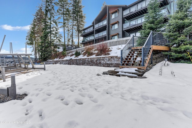 snowy yard with stairway