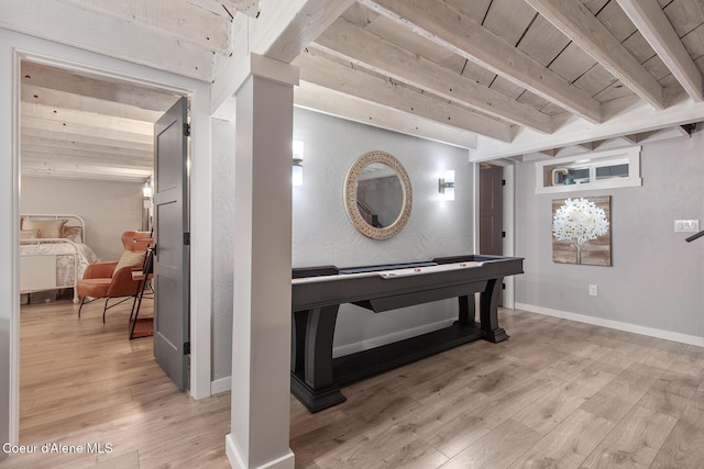 interior space featuring wood ceiling, beamed ceiling, light wood-style flooring, and baseboards