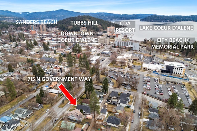 birds eye view of property with a mountain view