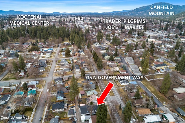 birds eye view of property featuring a residential view and a mountain view