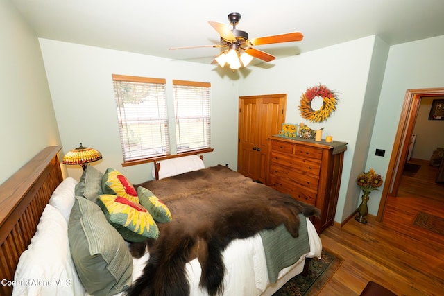 bedroom with ceiling fan and wood finished floors