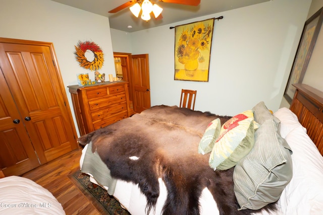 bedroom featuring ceiling fan and wood finished floors