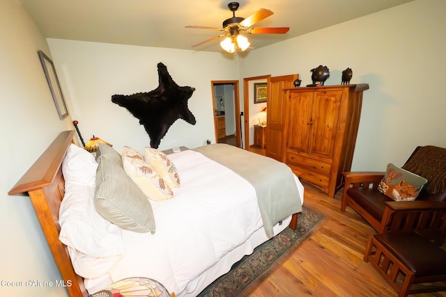 bedroom featuring a ceiling fan and wood finished floors