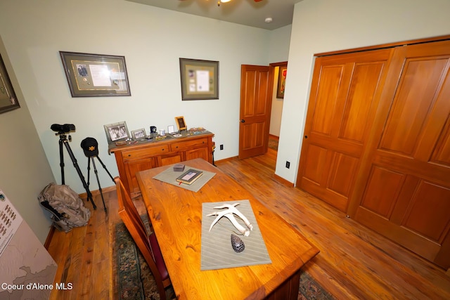 office with light wood-type flooring and baseboards