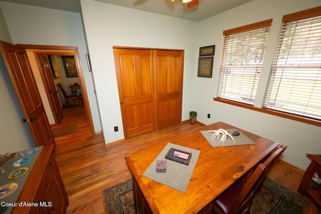 dining room with baseboards and wood finished floors