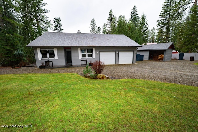 single story home featuring a chimney, an attached garage, gravel driveway, and a front yard