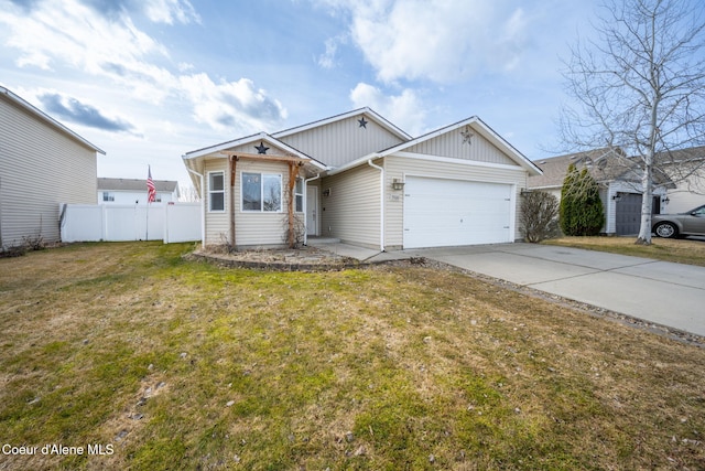 view of front of home featuring concrete driveway, an attached garage, fence, and a front yard