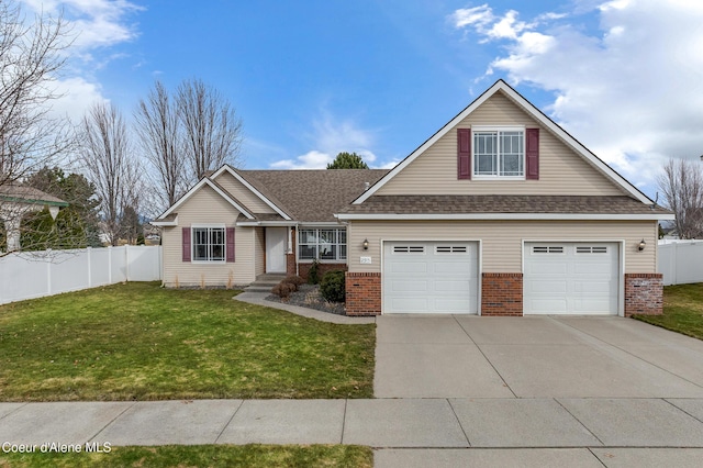 view of front of property with brick siding, concrete driveway, a front lawn, and fence