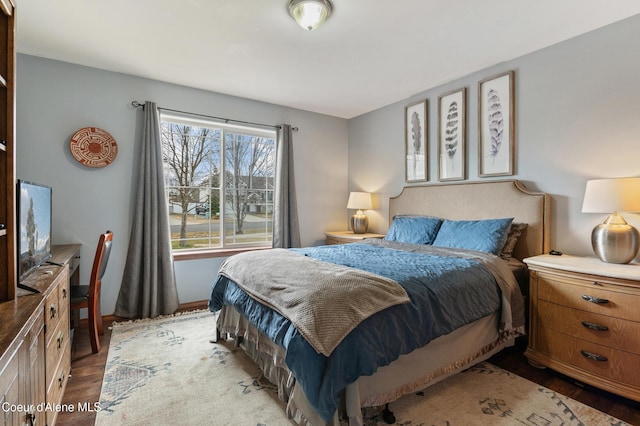 bedroom with wood finished floors