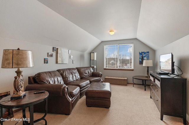 carpeted living area with lofted ceiling