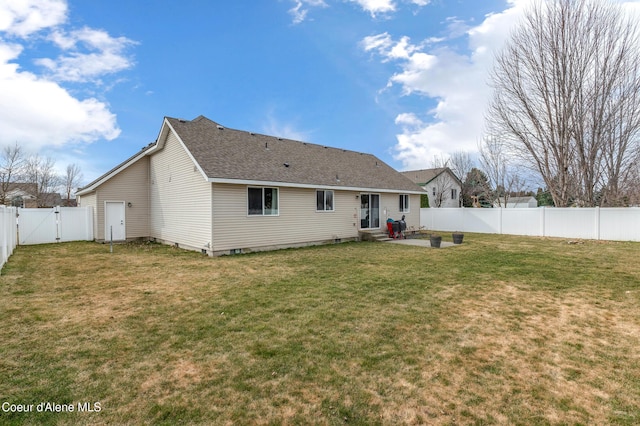 rear view of property featuring entry steps, a fenced backyard, a yard, a patio, and a gate