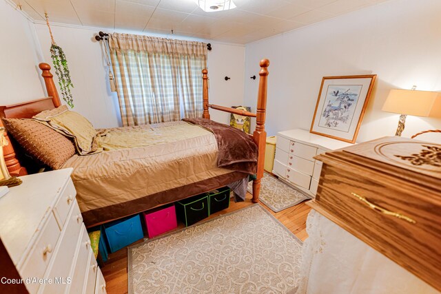 bedroom with wood finished floors