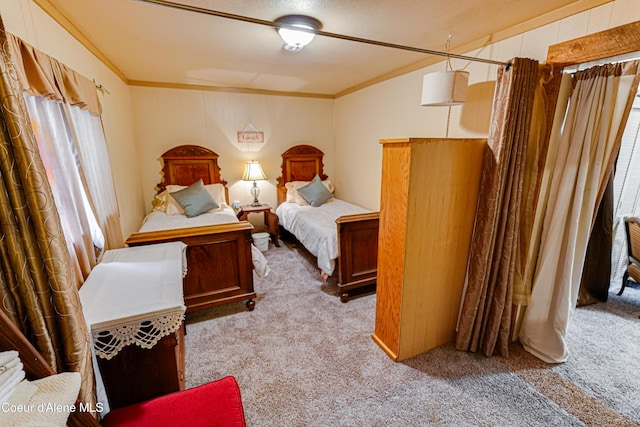 bedroom featuring carpet flooring and ornamental molding