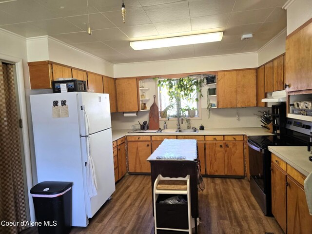 610 E Ockert St, Oldtown, ID 83822 - kitchen featuring brown cabinets, open shelves, freestanding refrigerator, under cabinet range hood, and electric range oven