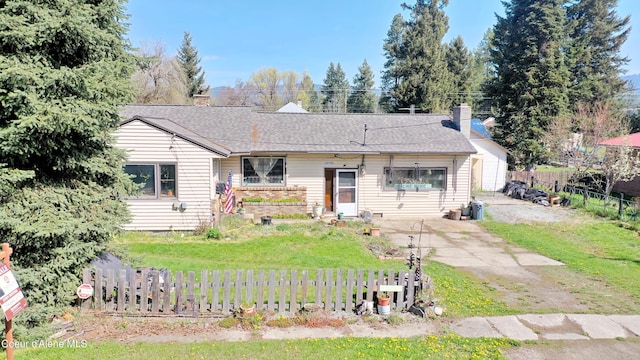 610 E Ockert St, Oldtown, ID 83822 - view of front of property with a chimney, fence private yard, a front lawn, and concrete driveway