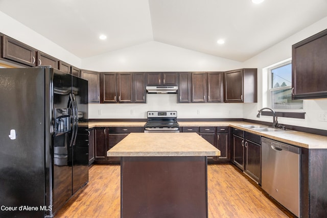 kitchen with a sink, light countertops, dark brown cabinets, under cabinet range hood, and appliances with stainless steel finishes