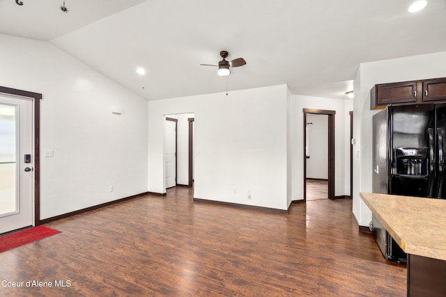 interior space with a ceiling fan, baseboards, recessed lighting, dark wood-style flooring, and vaulted ceiling