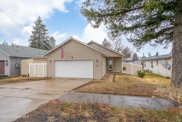 ranch-style home featuring a gate, driveway, a garage, and fence