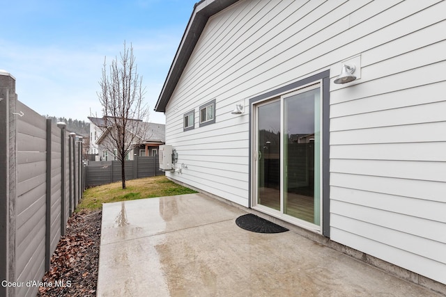 view of patio / terrace featuring fence