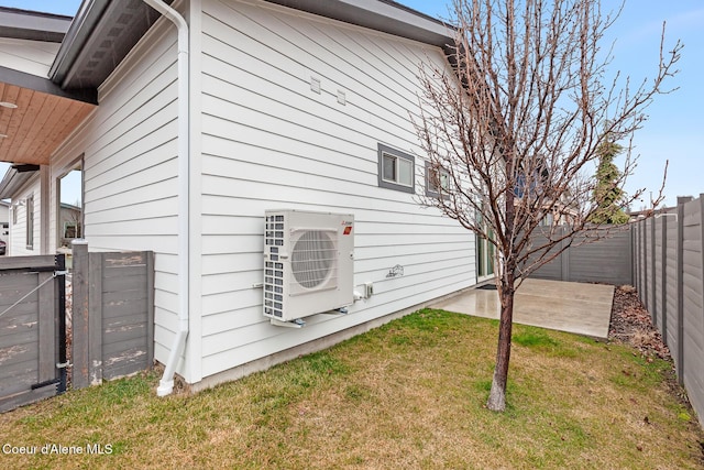 view of property exterior with a patio area, a lawn, a fenced backyard, and ac unit