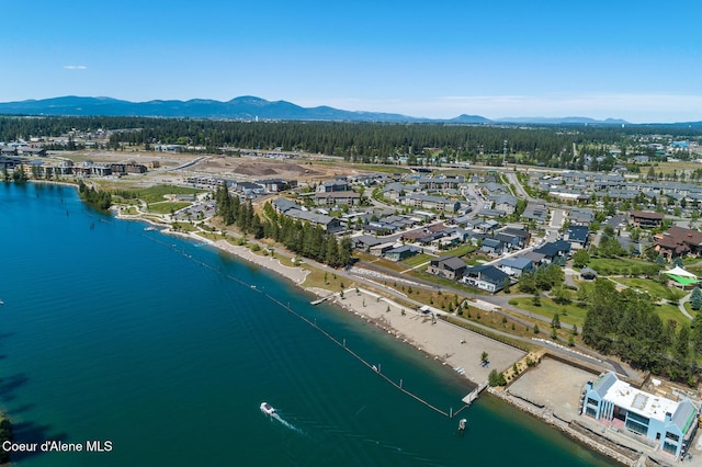 birds eye view of property featuring a water and mountain view