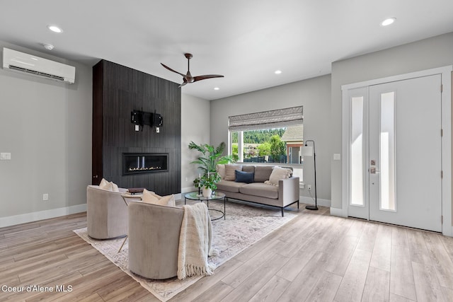 3016 N Casa Ct, Coeur Dalene, ID 83814 - living room featuring an AC wall unit, ceiling fan, wood finished floors, a fireplace, and recessed lighting