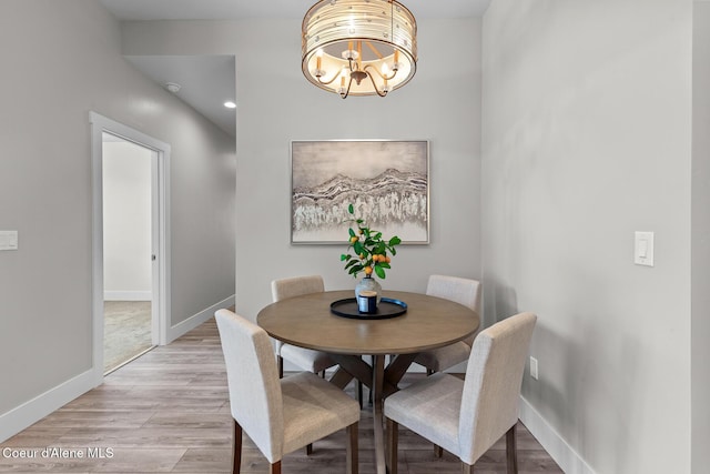 3016 N Casa Ct, Coeur Dalene, ID 83814 - dining space with a chandelier and light wood finished floors