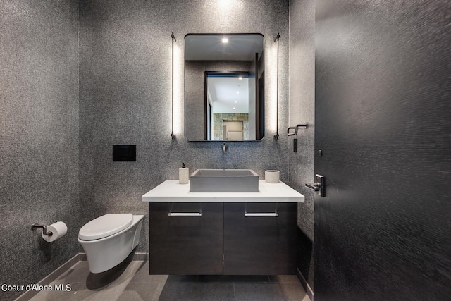 bathroom with tile patterned floors, toilet, and vanity