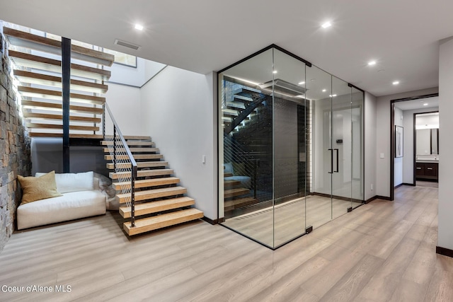 wine cellar featuring visible vents, recessed lighting, baseboards, and wood finished floors