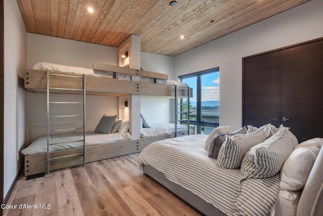 bedroom with wood finished floors, recessed lighting, and wood ceiling