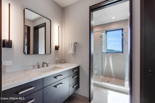 full bathroom with tile patterned floors, toilet, a stall shower, and vanity