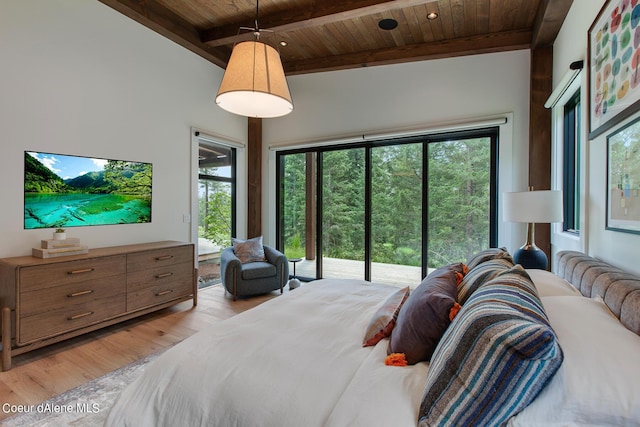 bedroom featuring beam ceiling, wood ceiling, access to outside, multiple windows, and light wood-type flooring