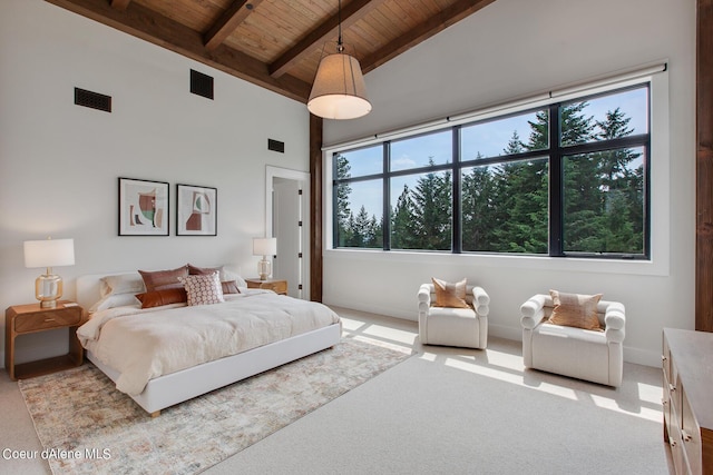 bedroom featuring visible vents, high vaulted ceiling, wooden ceiling, beamed ceiling, and carpet flooring