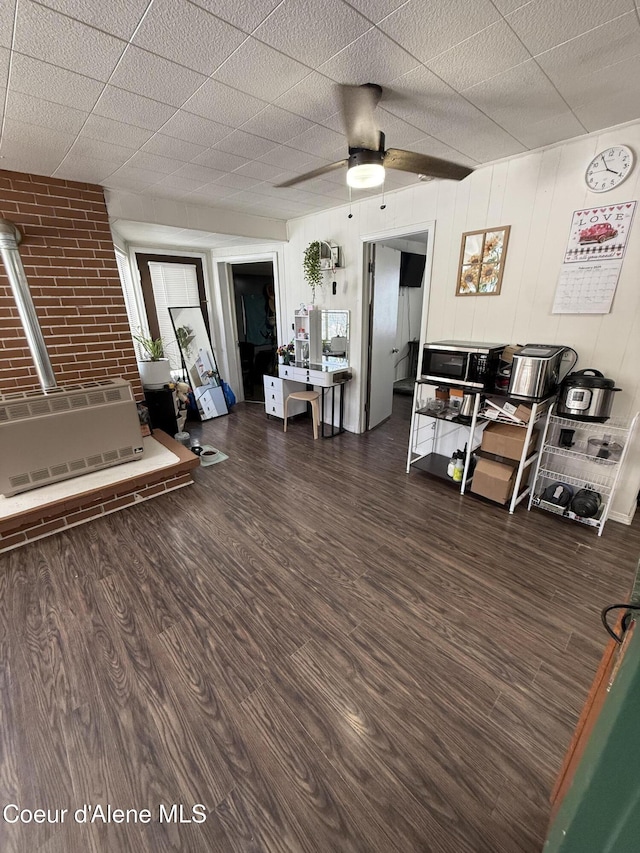 interior space with ceiling fan and wood finished floors