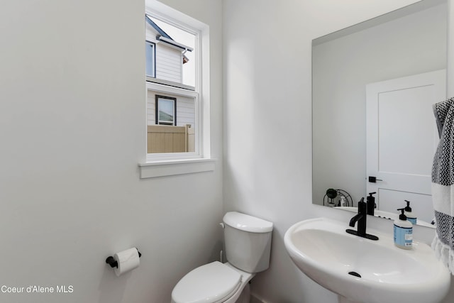 bathroom with toilet and a sink