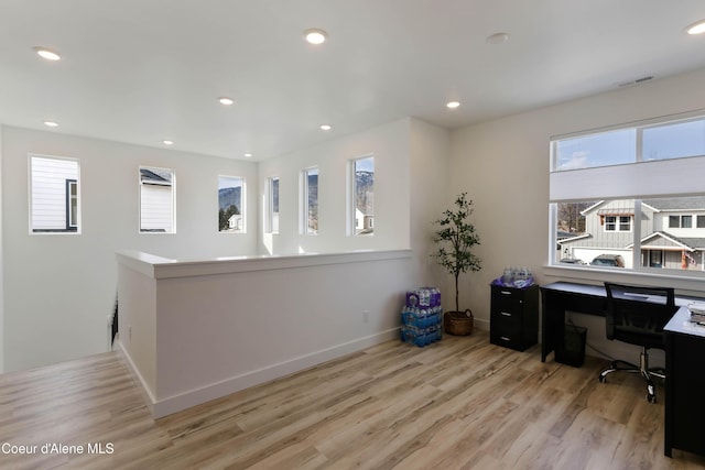 home office with recessed lighting, visible vents, baseboards, and wood finished floors