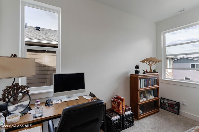 carpeted home office with visible vents