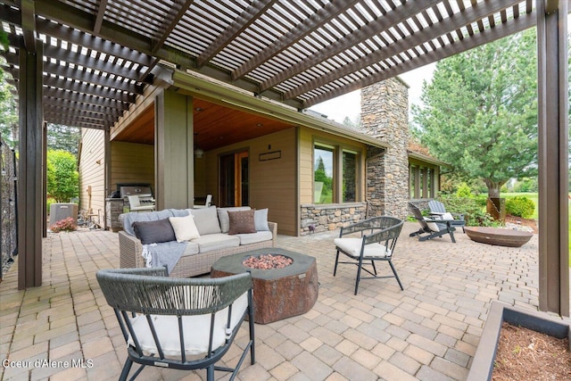 1665 E Club Ln, Hayden Lake, ID 83835 - view of patio / terrace featuring a pergola, central air condition unit, and an outdoor living space with a fire pit