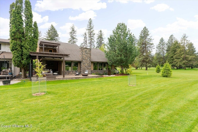 1665 E Club Ln, Hayden Lake, ID 83835 - view of grassy yard featuring a patio area